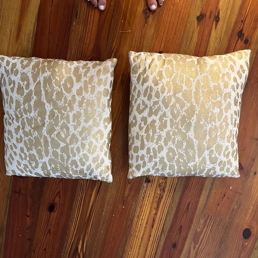 Two gold cheetah throw pillows